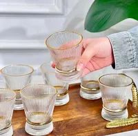 طقم أكواب زجاجية مضلعة بحواف ذهبية