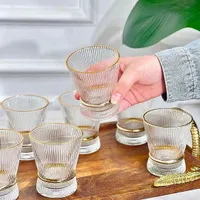 طقم أكواب زجاجية مضلعة بحافة ذهبية