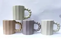 مج سيراميك بتصميم مضلع ومقبض كروي
