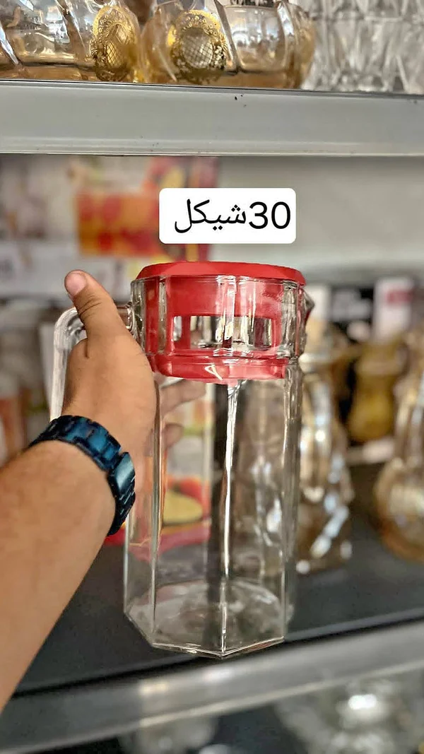 إبريق زجاجي بغطاء أحمر - أدوات منزلية - سوق غزة