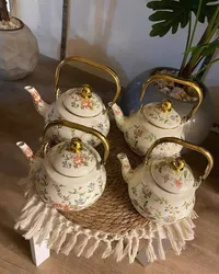 إبريق شاي سيراميك مزخرف بنقوش زهور