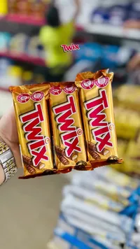 أصابع بسكويت مغطاة بالكراميل والشوكولاتة - تويكس (Twix)