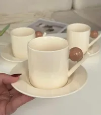 طقم فناجين قهوة سيراميك كريمي مع صحون