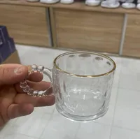 كوب زجاجي بمقبض مزخرف (Glass Mug)