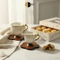 أكواب قهوة بتصميم ذهبي - ADC