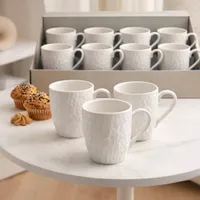 طقم أكواب سيراميك أبيض بتصميم بارز