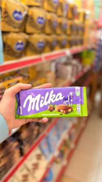 شوكولاتة بالحليب مع البندق الكامل - ميلكا (Milka)