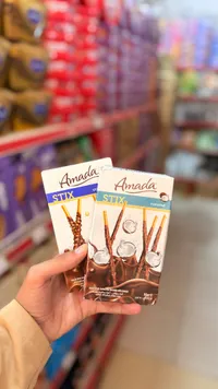 أصابع بسكويت مغطاة بالشوكولاتة وجوز الهند - أمادا (Amada)