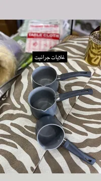 مجموعة أواني طهي بمقابض سوداء