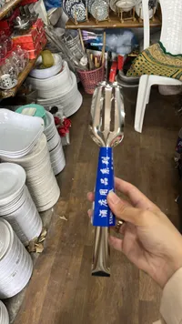 ملقط طعام ستانلس ستيل بمقبض أزرق