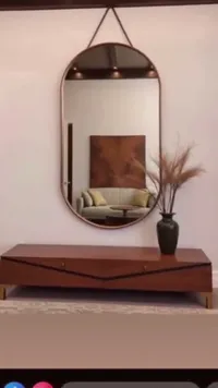 مرآة حائط بيضاوية بإطار معدني