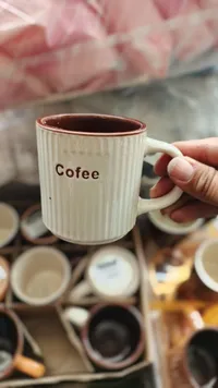 كوب سيراميك مخطط للقهوة