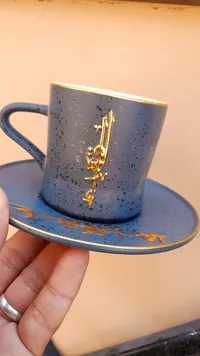 فنجان قهوة سيراميك مزخرف بالخط العربي