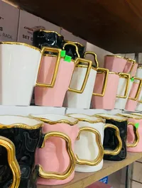 أكواب سيراميك بمقبض ذهبي