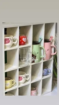 مجموعة أكواب سيراميك ملونة مع رف تنظيم
