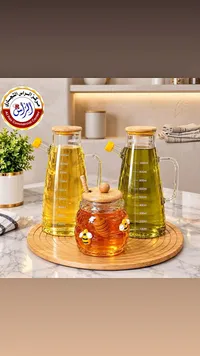 أدوات مطبخ وزجاجات زيت مع علبة عسل (Al Ras Commercial Center)