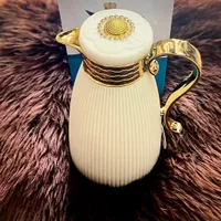 دلة قهوة وشاي بتصميم عصري - أبيض وذهبي