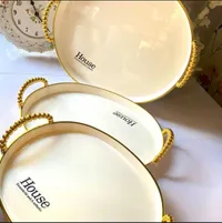أطباق تقديم House بمقابض ذهبية