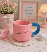مج سيراميك وردي بمقبض أزرق - محلات عزيزة