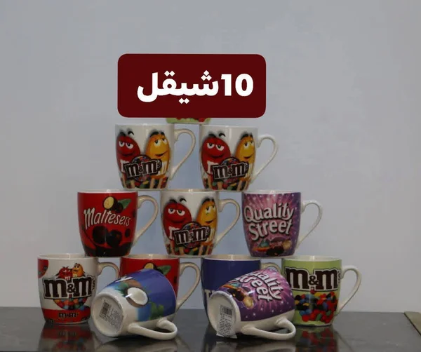 مج سيراميك برسومات شوكولاتة متنوعة (M&M's, Maltesers, Quality Street) - أدوات منزلية - سوق غزة