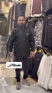 بدلة رياضية نايك - جاكيت وبنطال أسود