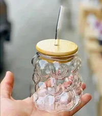 كوب زجاجي بتصميم فقاعات مع غطاء خشبي وقشة