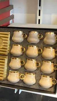 طقم فناجين سيراميك بمقابض ذهبية