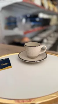 فنجان قهوة مع صحن - إيه بي سي