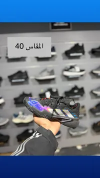 حذاء رياضي أديداس - أسود وأزرق