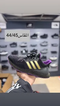 حذاء رياضي أديداس - أسود وذهبي وبنفسجي