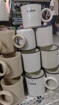 مج سيراميك مخطط للقهوة