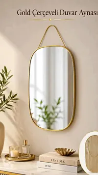 مرآة حائط بيضاوية بإطار ذهبي