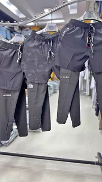 شورت رياضي مزدوج مع بنطال داخلي - تشكيلة رياضية (Under Armour & The North Face)