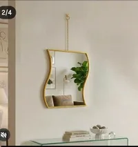 مرآة حائط ذهبية بإطار معدني