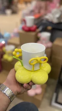مج سيراميك بتصميم زهرة مع صحن