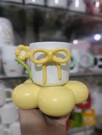 مج سيراميك بتصميم الزهرة والفيونكة