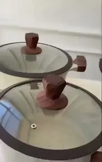 طقم قدور جرانيت بمقابض خشبية