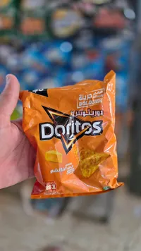 رقائق ذرة بطعم جبن الناتشو - دوريتوس (Doritos)