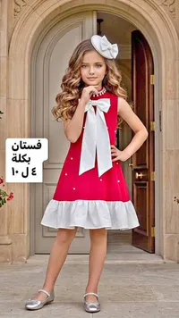 فستان أحمر بفيونكة بيضاء مع بكلة شعر