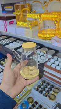 إبريق زجاجي للزيت بغطاء خشبي