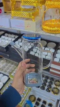 إبريق زجاجي للزيت بغطاء أزرق