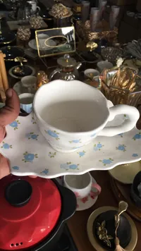 طقم فنجان قهوة مع صحن بتصميم الزهور