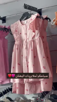 فستان أطفال وردي مزين بالورود