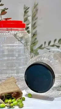 زجاجات تخزين زجاجية مع أغطية ملونة