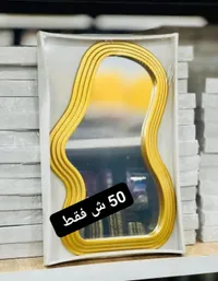 مرآة حائط بتصميم عصري متموج - إطار ذهبي - سوق غزة