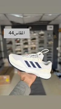 حذاء أديداس رياضي - أبيض وأزرق