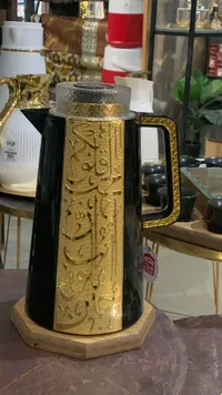 تيرمس ستانلس ستيل - ذهبي وأسود