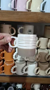 مج نسكافيه سيراميك بتصميم مخطط