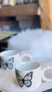 طقم أكواب سيراميك بتصميم الفراشة ومقبض لؤلؤي