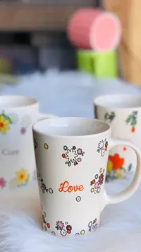 مج سيراميك بتصميم الزهور وكلمة لوف (Love)